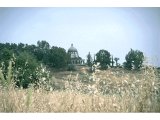 Mount of Beatitudes - The Church (distant). Fields and heads of corn in foreground, with church in background.